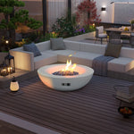 Outdoor concrete natural gas fire pit bowl on a modern patio with wooden decking, surrounded by white sectional seating and garden decor.